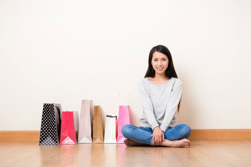 Woman-with-shopping-bag-in-home