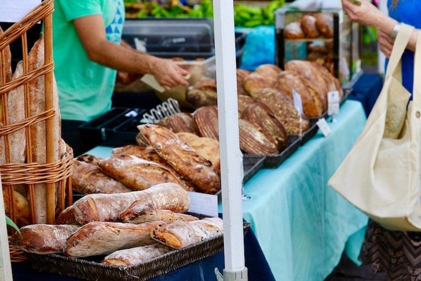 shopper choosing which bread to buy