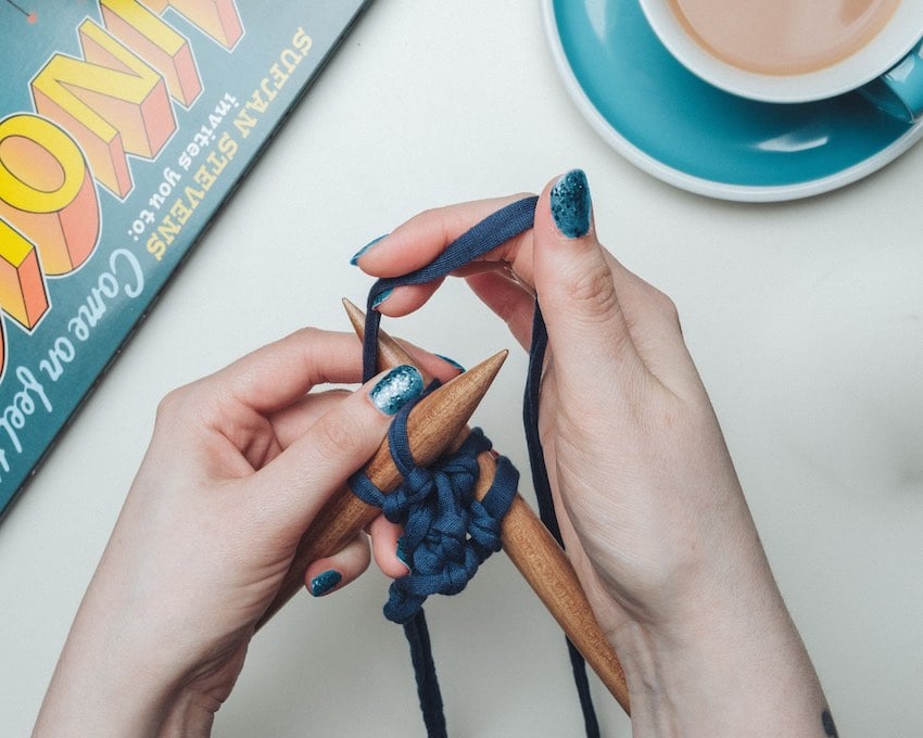 young gen y woman knitting